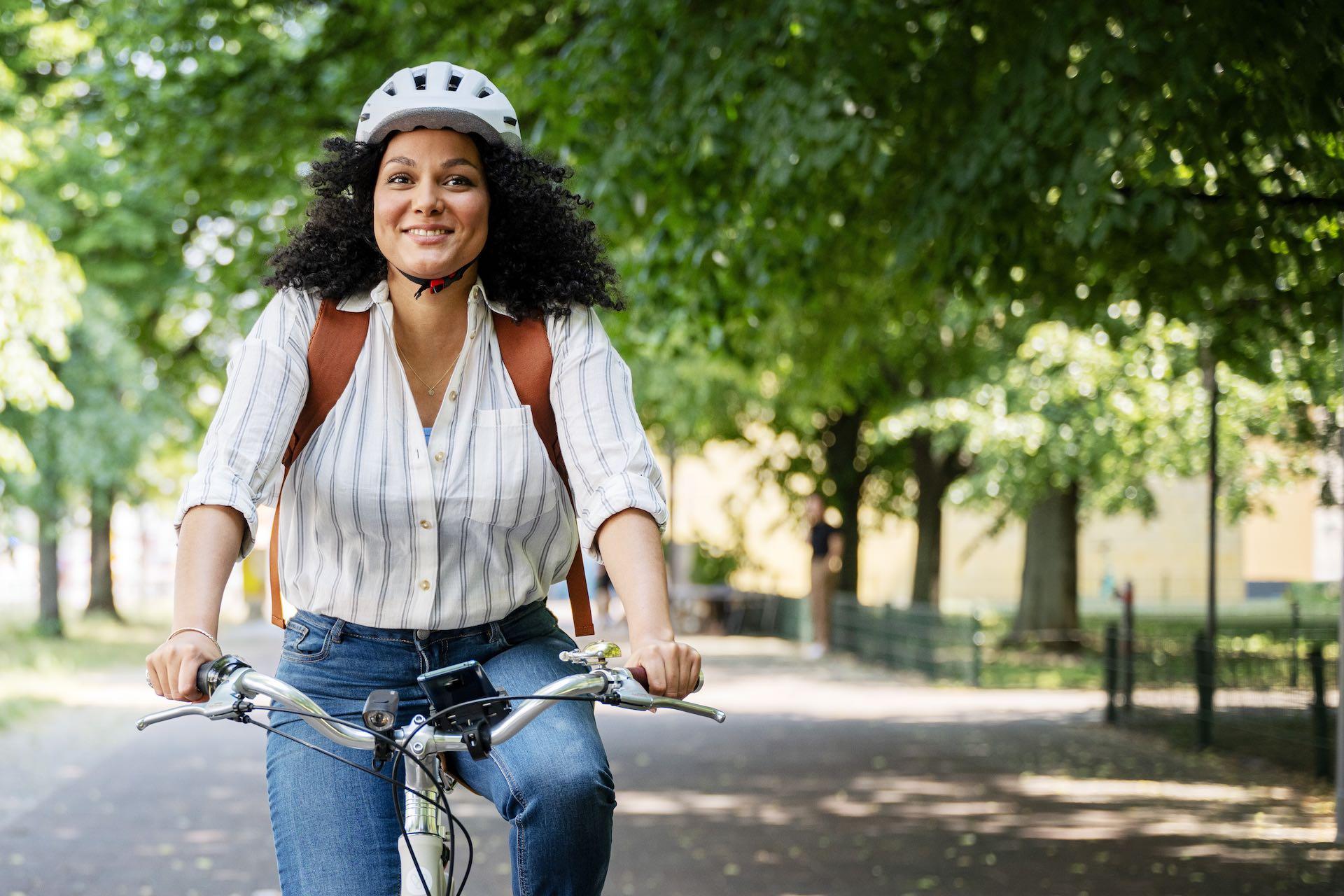 A woman is riding a bicycle